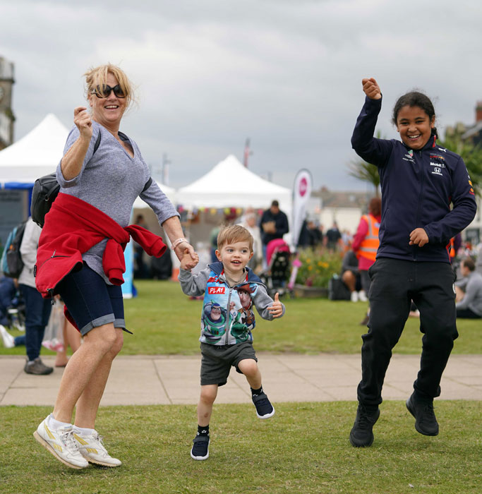 family-jumping-at-the-festival